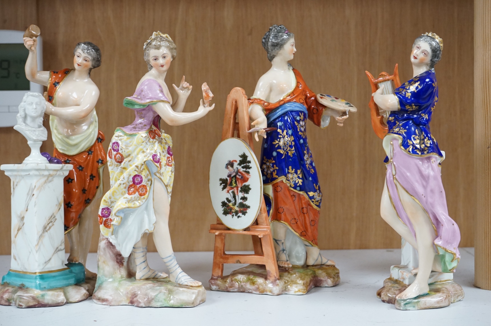 A set of four French Derby style porcelain figures, emblematic of art, sculpture, music and theatre, tallest art 22.5cm high